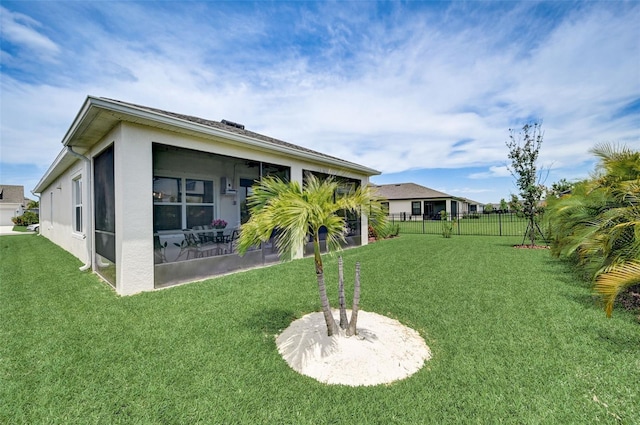 view of yard with a sunroom