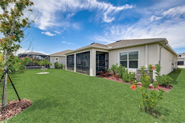 back of house featuring a lanai, cooling unit, a yard, and a sunroom