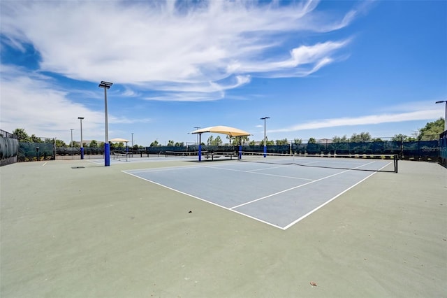 view of sport court with basketball hoop