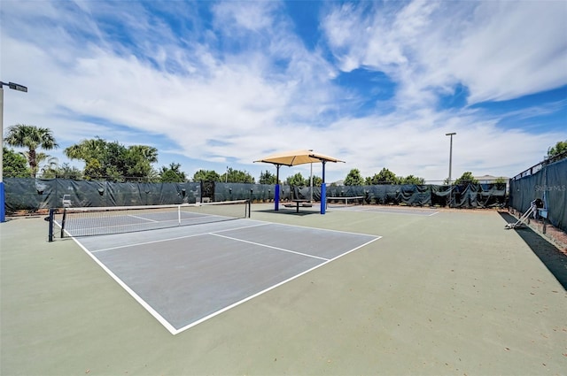 view of tennis court featuring basketball court