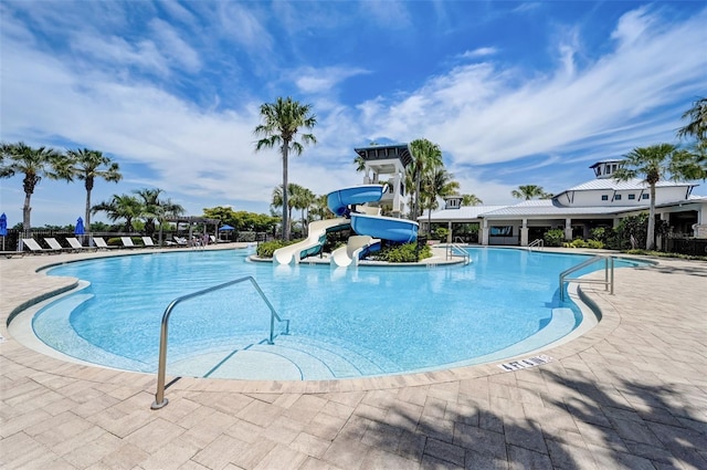 view of swimming pool featuring a water slide