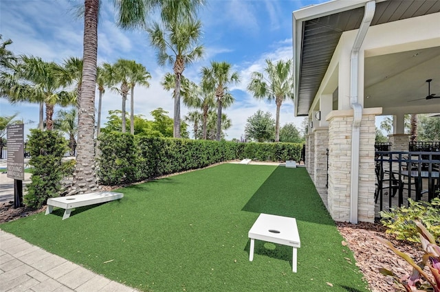 view of yard featuring ceiling fan