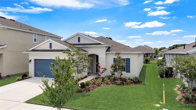 view of front of home featuring a garage and a front yard