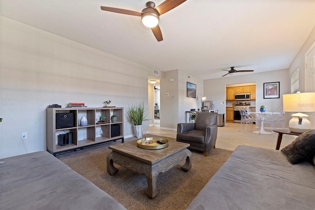 living room featuring ceiling fan