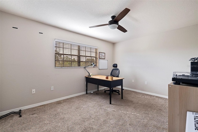 office area with ceiling fan, carpet, and a textured ceiling