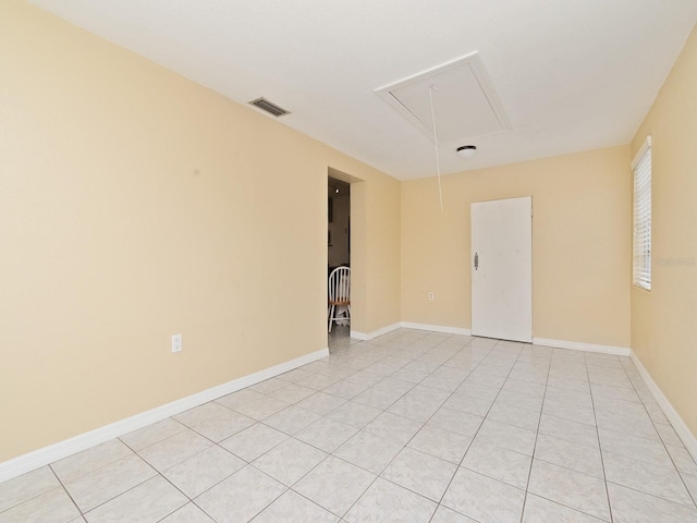 empty room with light tile patterned floors