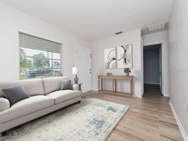 living room with light hardwood / wood-style floors