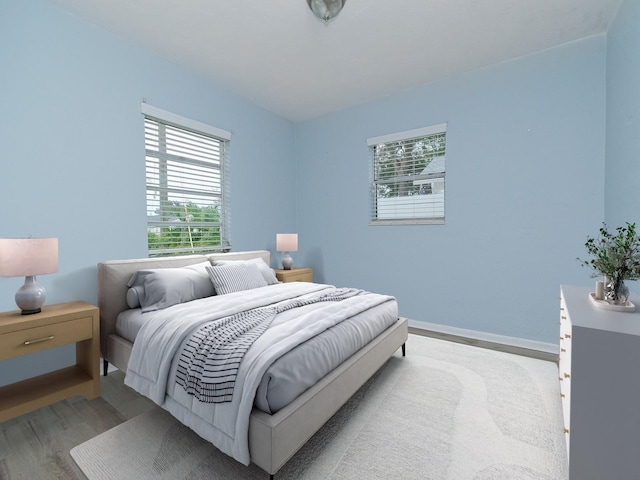 bedroom featuring wood-type flooring