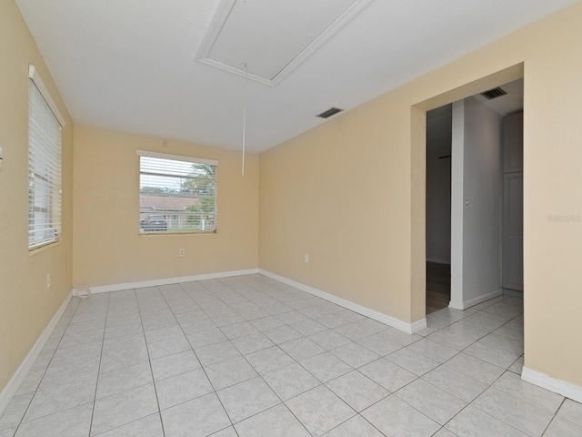 spare room with light tile patterned flooring