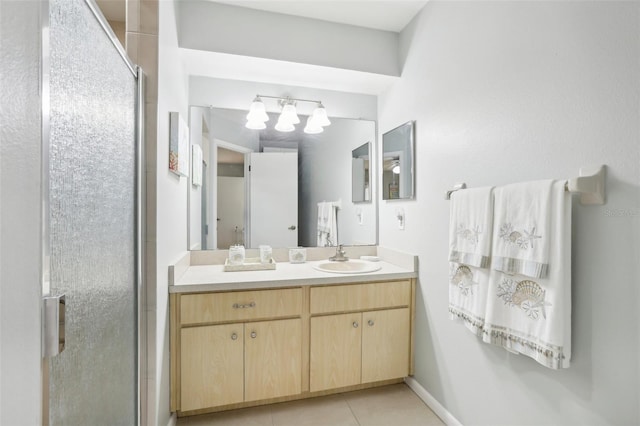 bathroom featuring vanity, tile patterned floors, and walk in shower