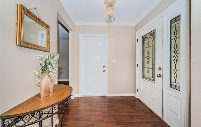 foyer entrance with ornamental molding and dark wood-type flooring