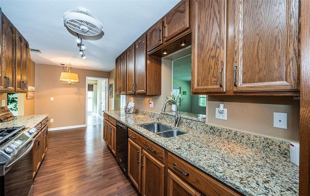 kitchen featuring hanging light fixtures, sink, stainless steel stove, black dishwasher, and dark hardwood / wood-style flooring