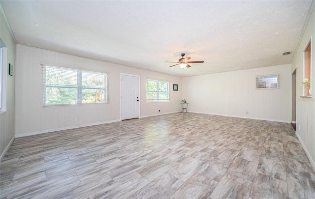 spare room with ceiling fan and light hardwood / wood-style floors