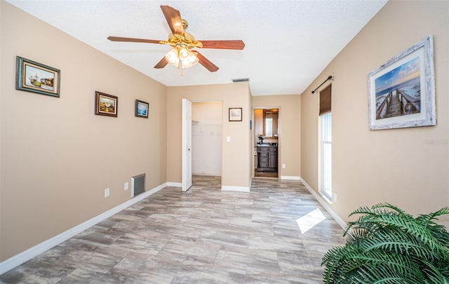 hall with a textured ceiling