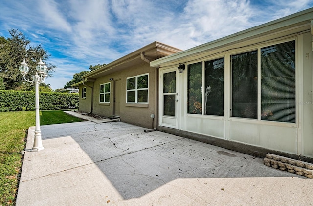 exterior space with a patio area and a yard