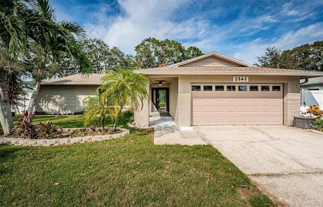 ranch-style home featuring a front lawn and a garage