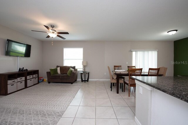 10348 Blue Plume Ct, Riverview, FL 33578 - living room with plenty of natural light, ceiling fan, light tile patterned flooring, and baseboards