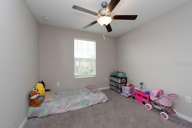 bedroom with ceiling fan and carpet floors