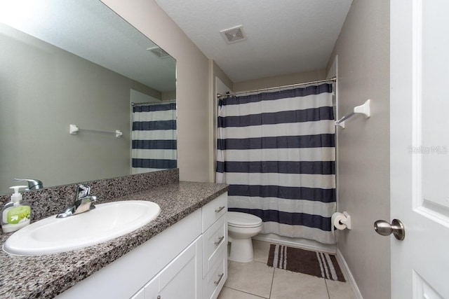 bathroom with curtained shower, tile patterned floors, a textured ceiling, toilet, and vanity