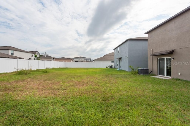 view of yard featuring central AC