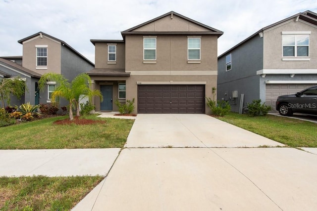 10348 Blue Plume Ct, Riverview, FL 33578 - traditional home featuring stucco siding, a garage, a front yard, and concrete driveway