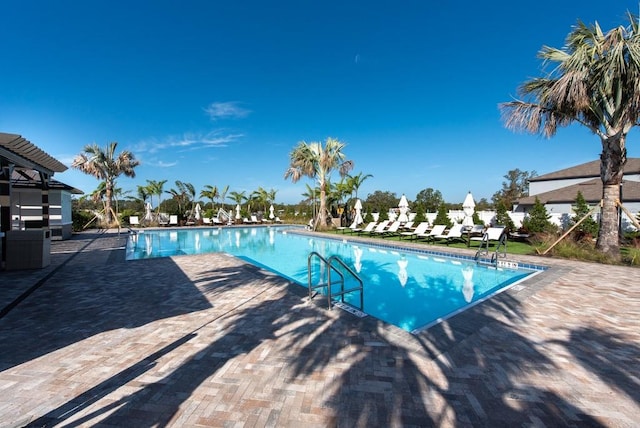 view of swimming pool with a patio