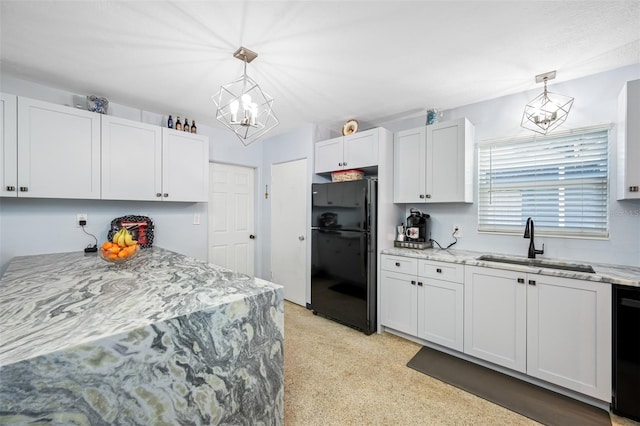 kitchen featuring pendant lighting, white cabinets, sink, and black appliances