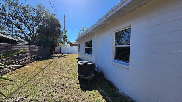 view of yard featuring central air condition unit