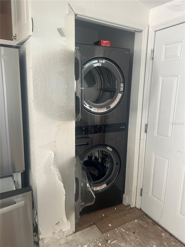 washroom with stacked washer / dryer