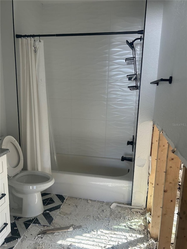 full bathroom featuring vanity, toilet, shower / bath combo with shower curtain, and tile patterned flooring