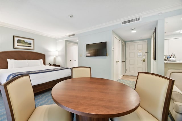 bedroom featuring crown molding