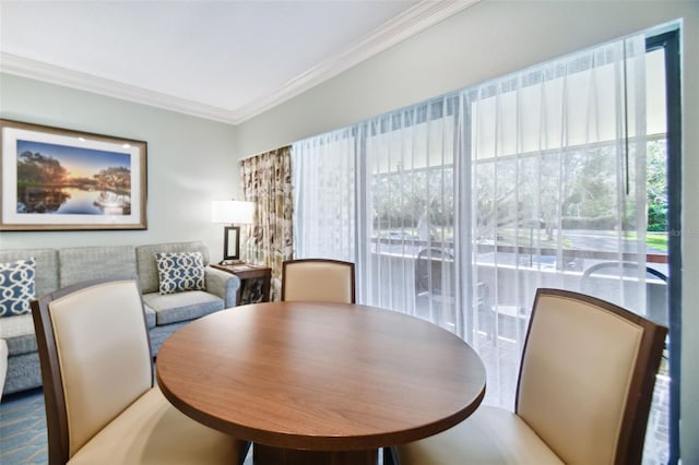 dining room featuring ornamental molding