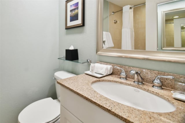 bathroom featuring vanity, toilet, and a shower with curtain