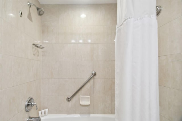 bathroom with shower / bath combination with curtain