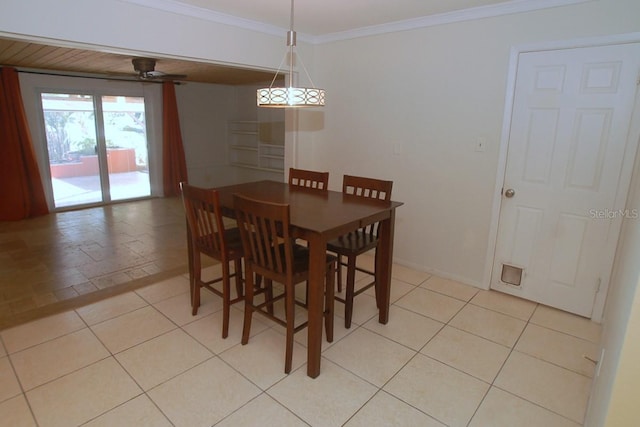 dining space with ceiling fan, light tile patterned flooring, and ornamental molding