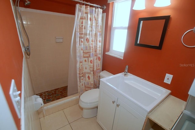 bathroom featuring tile patterned floors, a shower with curtain, toilet, and vanity