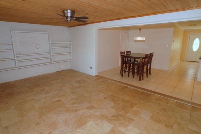 dining room with ceiling fan, crown molding, and wood ceiling