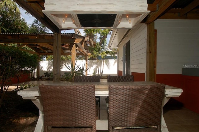 view of patio featuring a pergola and an outdoor bar