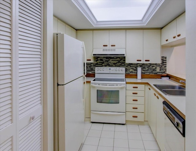 kitchen featuring sink, white cabinetry, light tile patterned floors, white appliances, and exhaust hood