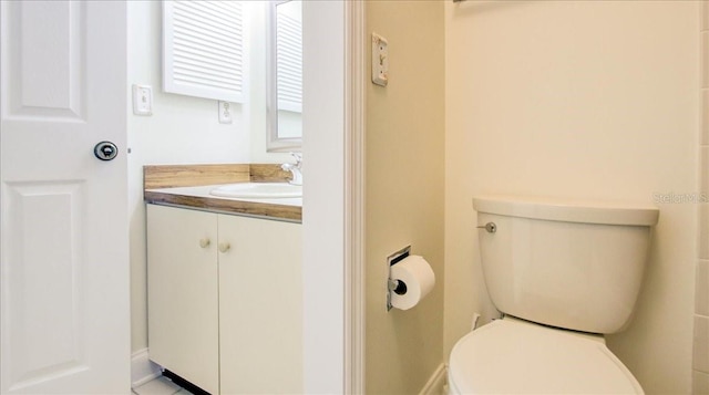 bathroom with vanity and toilet