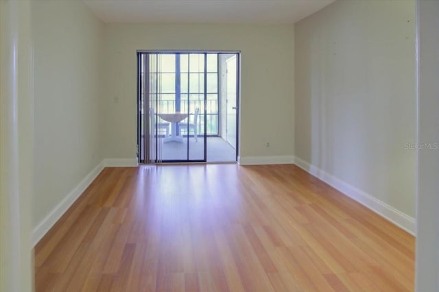 unfurnished room with light hardwood / wood-style flooring