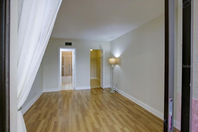 spare room with light hardwood / wood-style floors