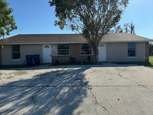 5928 13th Street Ct E, Bradenton, FL 34203 - single story home with stucco siding and a shingled roof