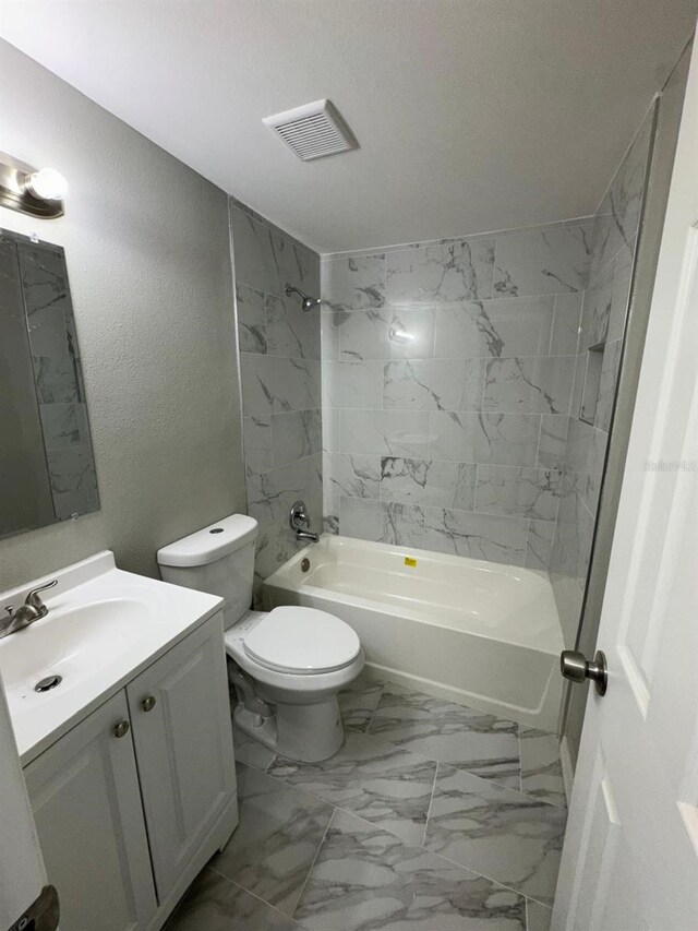 5928 13th Street Ct E, Bradenton, FL 34203 - bathroom with toilet, visible vents, shower / bath combination, marble finish floor, and vanity