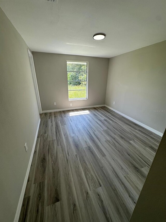 5928 13th Street Ct E, Bradenton, FL 34203 - unfurnished room with baseboards and wood finished floors