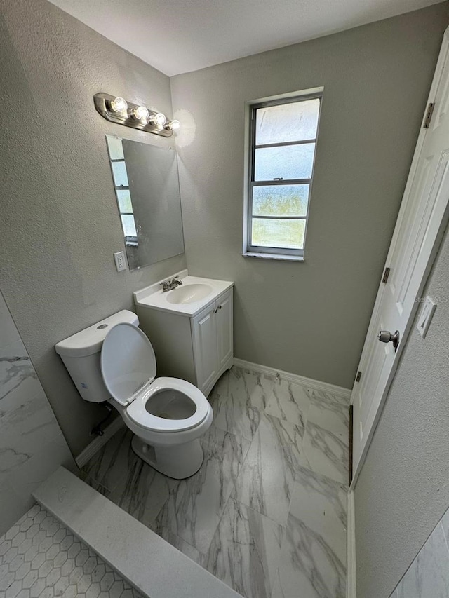 5928 13th Street Ct E, Bradenton, FL 34203 - bathroom with baseboards, marble finish floor, and vanity