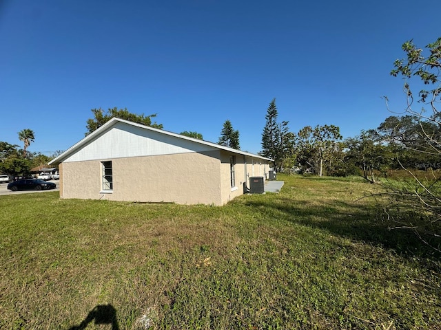 5928 13th Street Ct E, Bradenton, FL 34203 - view of property exterior featuring a yard, central AC, and stucco siding