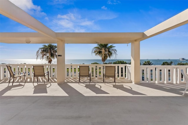 view of patio with a water view