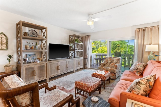 living room with hardwood / wood-style floors and ceiling fan