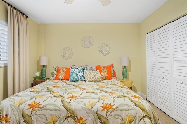 bedroom featuring a closet, ceiling fan, and carpet